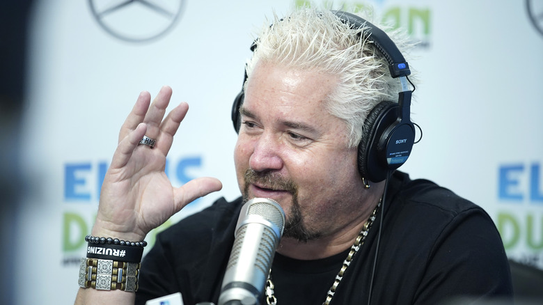 Guy Fieri with headphones on