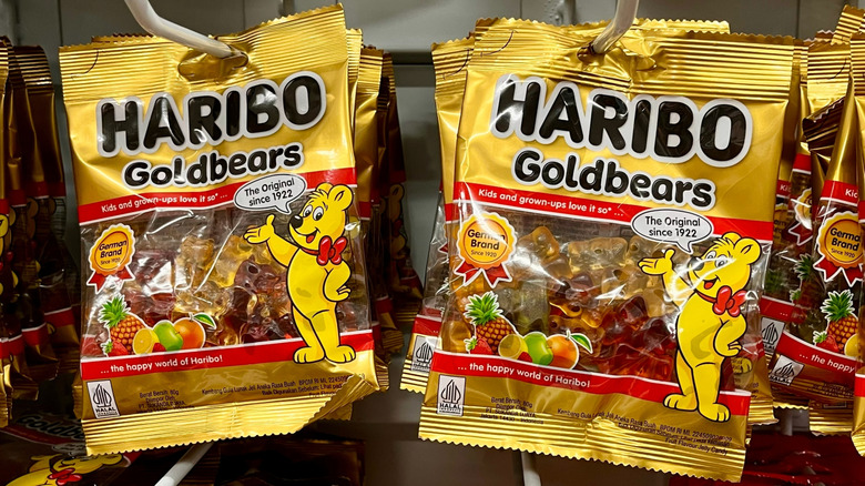Packages of Haribo Goldbears hanging on a wall.