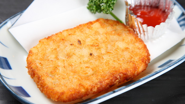 hash brown served with ketchup