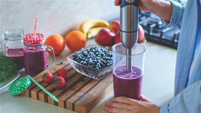 Making a smoothie using immersion blender