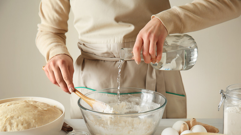 Adding water to bread dough