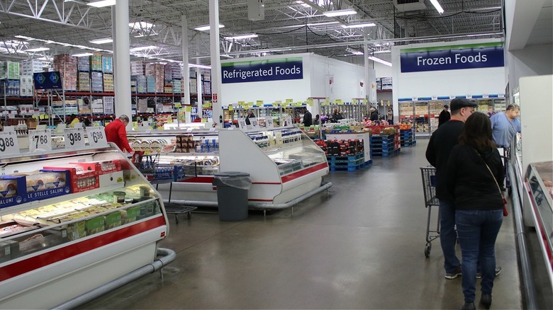 Sam's Club shoppers in refrigerated section