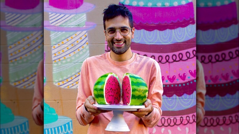 Jonny Manganello holding watermelon cake
