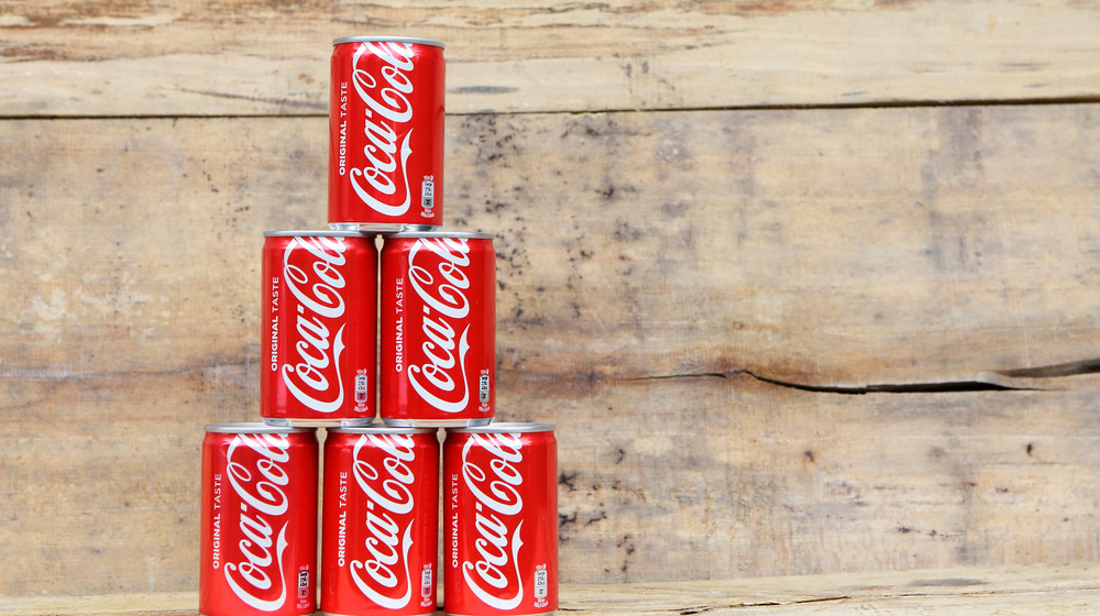 Coca-Cola cans in a stack