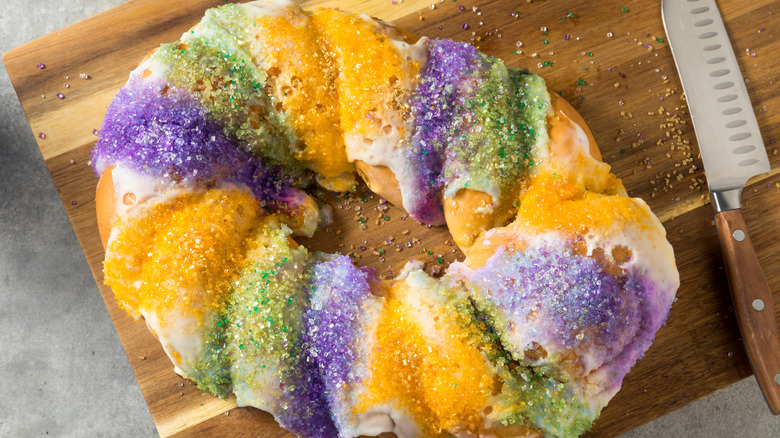 Braided king cake on cutting board