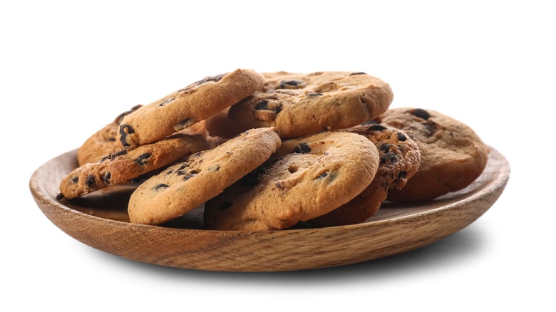 Chocolate chip cookies on wooden plate