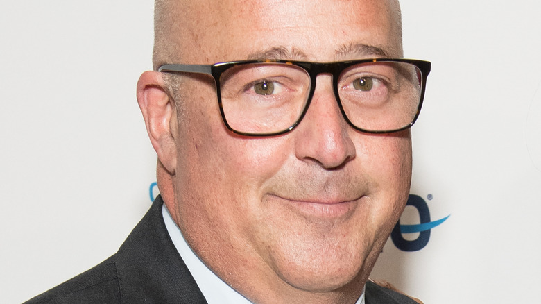 Andrew Zimmern wearing glasses