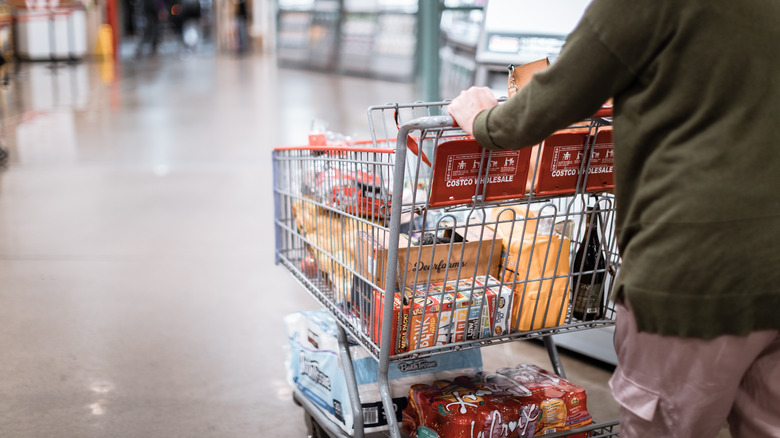 Costco shopper pushing cart