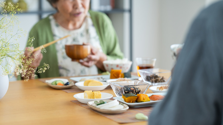 Elderly Japanese couple eating a meal
