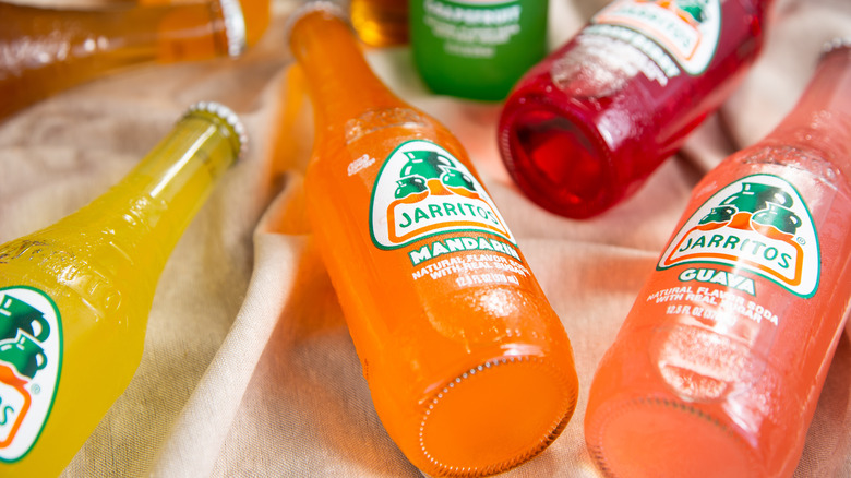 Jarritos soda flavors laying on cloth