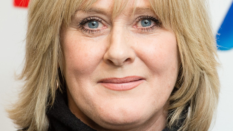 Sarah Lancashire with bands and slight smile