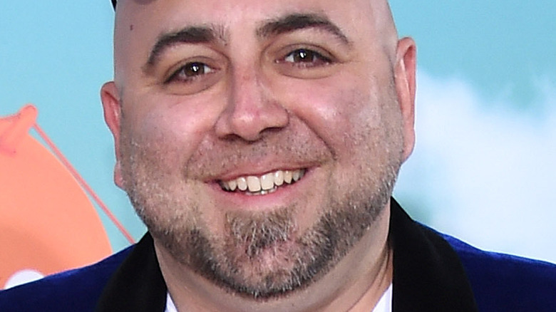 Duff Goldman smiling on the red carpet