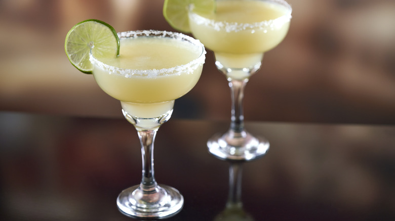 two margaritas on a bar