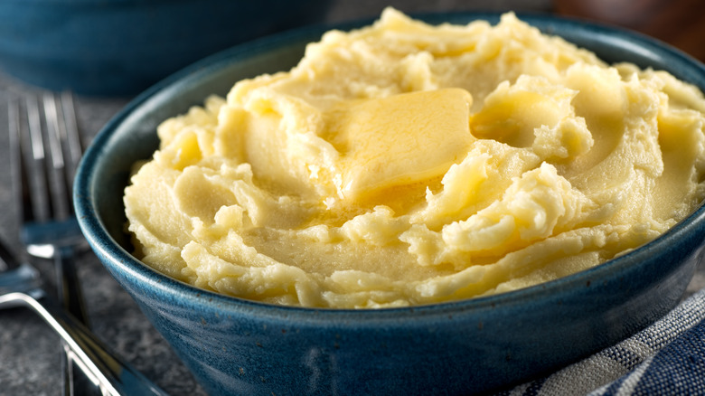 mashed potato in a bowl with butter