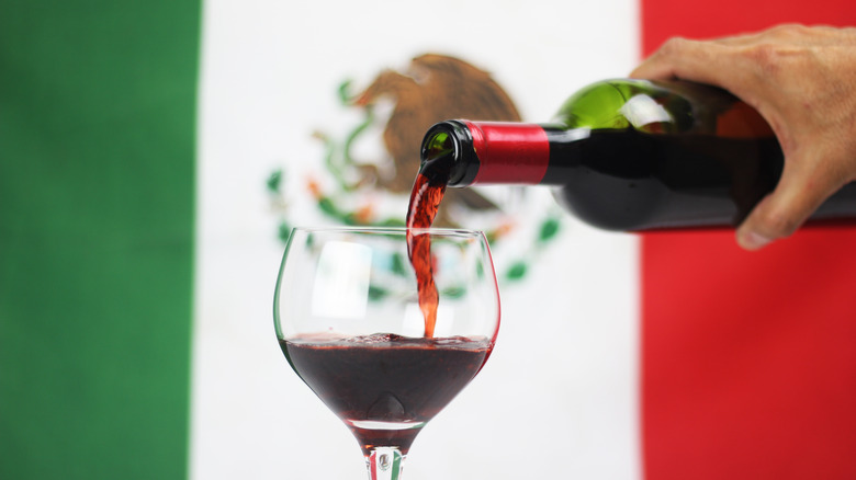 Wine being poured with Mexican flag background