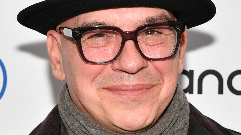 Michael Symon in hat, glasses, and scarf