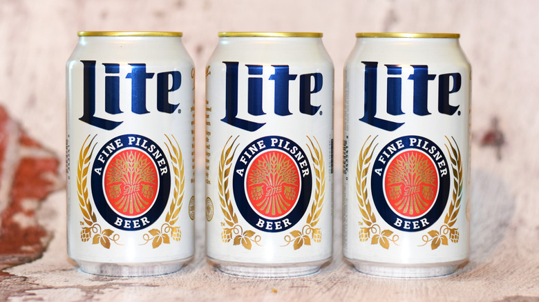 Three Miller Lite cans in a row