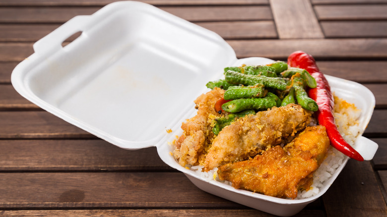 Fried food in polystyrene takeout box