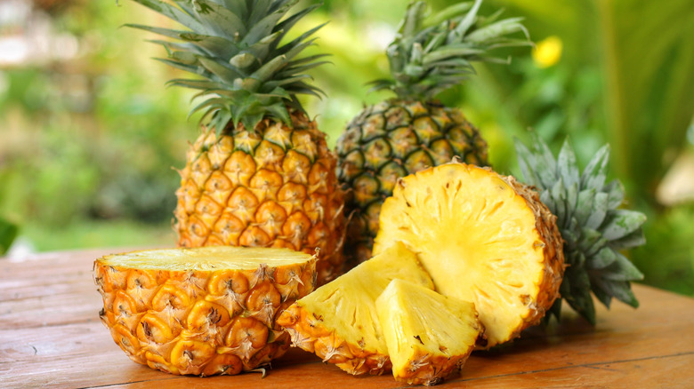 Whole and sliced pineapples