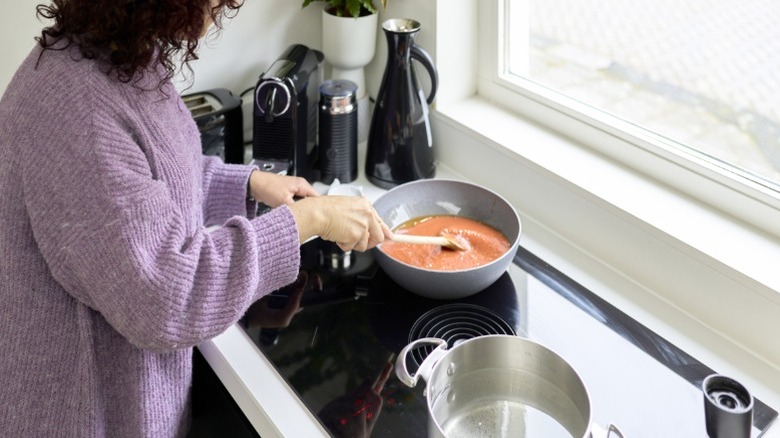 Woman making soup