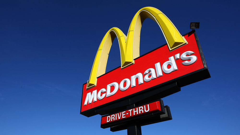 McDonald's sign with blue sky behind it