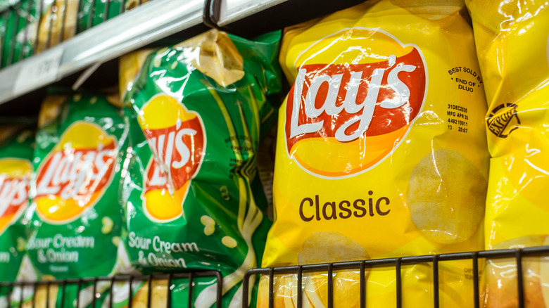 bags of lay's chips in supermarket