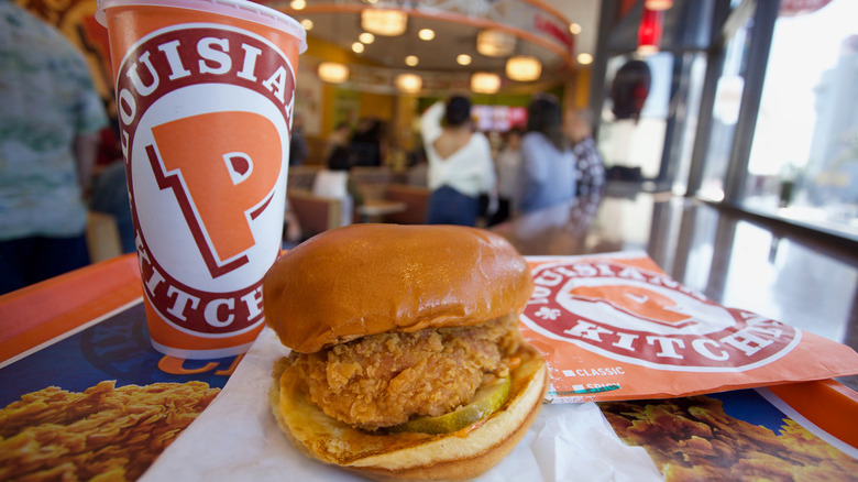 Popeyes sandwich and drink cup on a tray