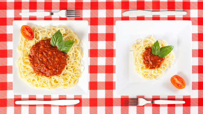 large and small plate of spaghetti