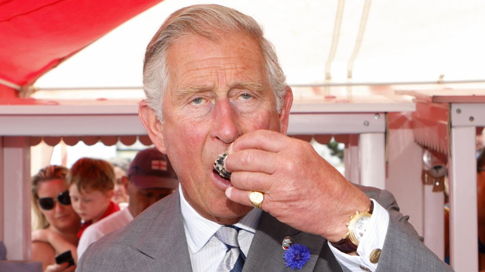 Prince Charles eats oysters at the Whitestable Oyster Festival.