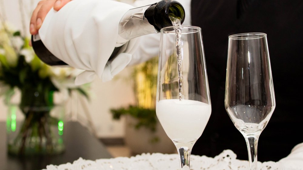 Champagne being poured into glasses 