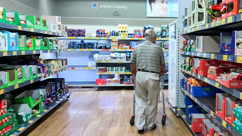 Man cruising an Aldi aisle  