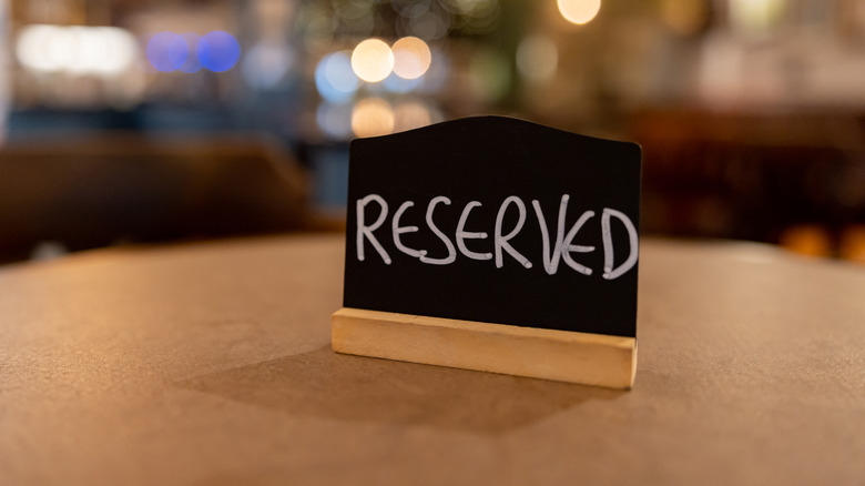 reserved sign on restaurant table