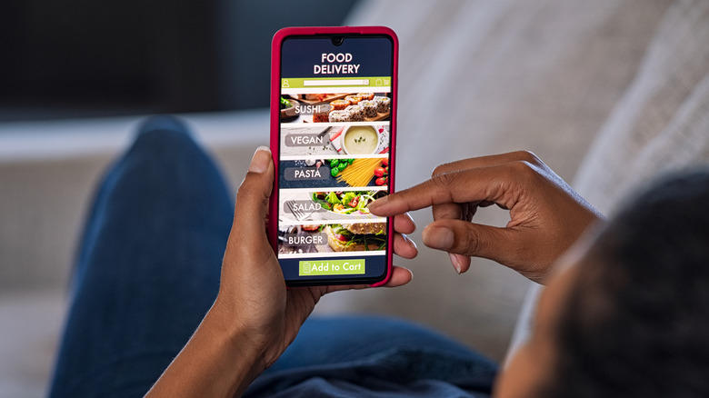 Woman using food delivery app
