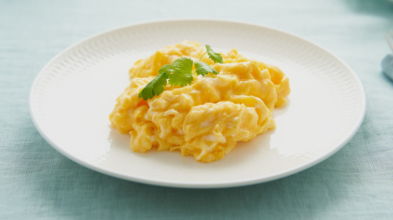 scrambled eggs on a white plate