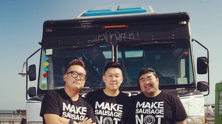 Seoul Sausage team standing in front of food truck