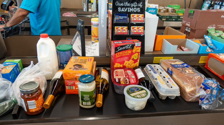 Aldi private label products on a register belt
