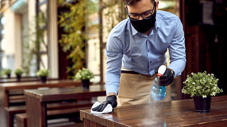 Cleaning off a restaurant table