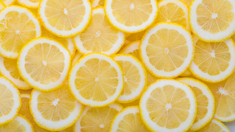  A background with slices of yellow lemon 