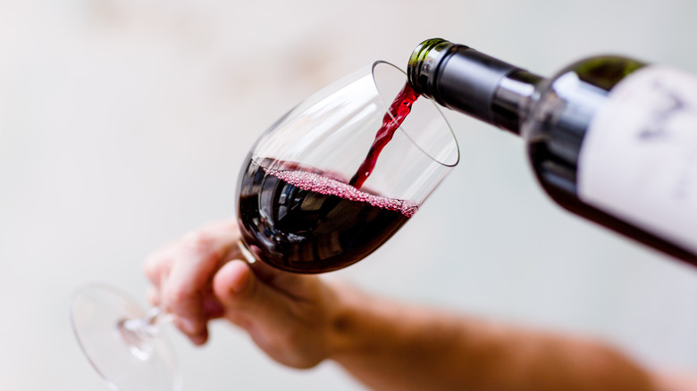 Red wine being poured into a glass