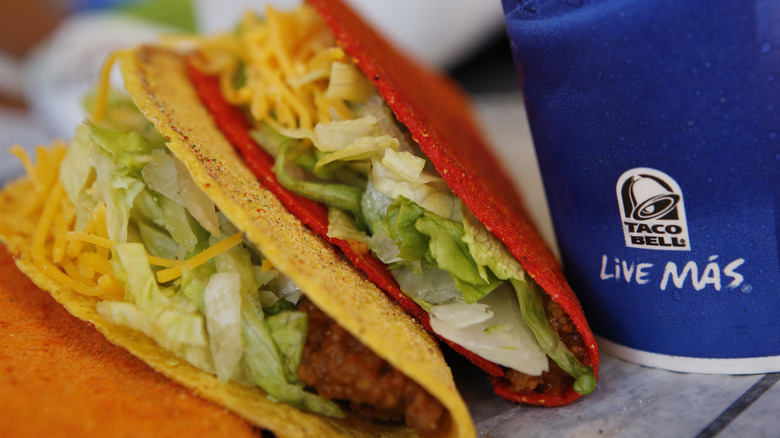 Doritos Locos Tacos next to Taco Bell drink cup