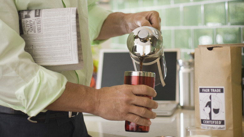 Pouring coffee into a thermos