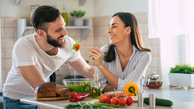 Couple eating veggies