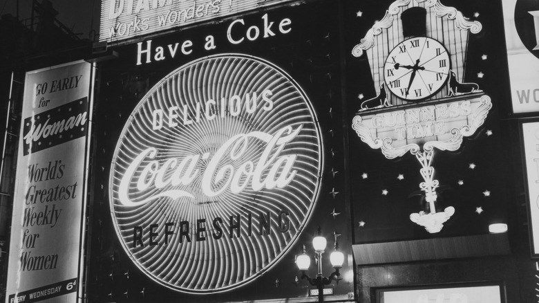Black and white photo of a historic Coca-Cola billboard