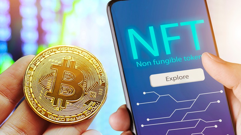 gold Bitcoin next to NFT phone screen