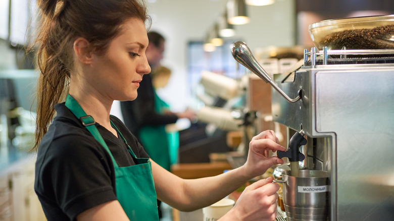 Starbucks barista in green apron