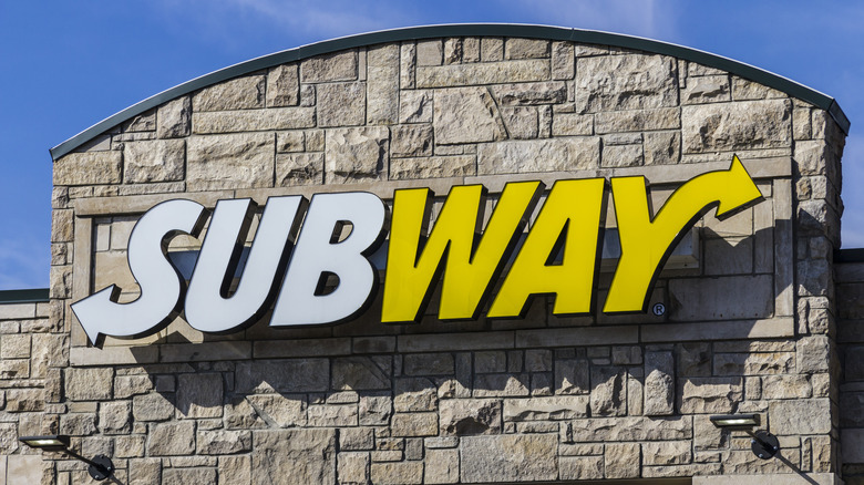 Subway sign on brick building