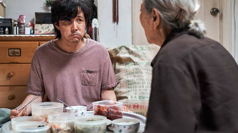 Seong Gi-hun eating with his mother