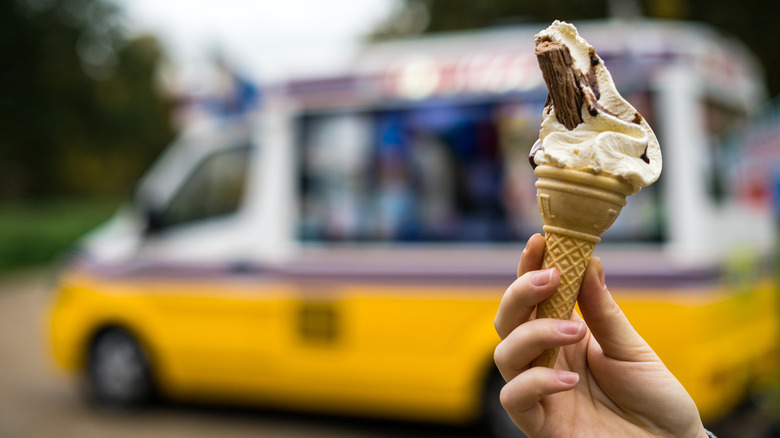 Person holding an ice cream cone