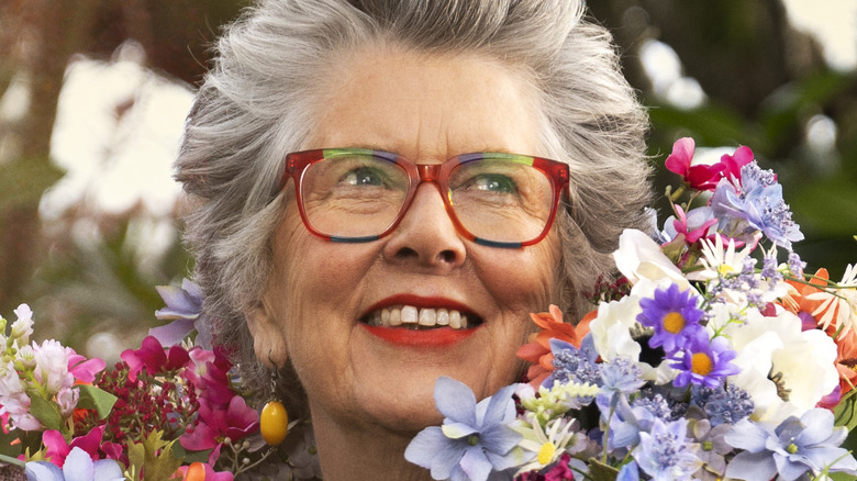 Dame Prue Leith with a bunch of flowers