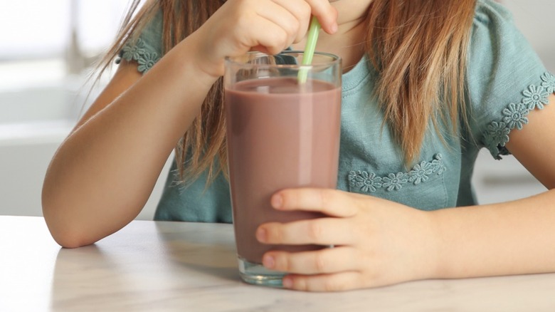 Child drinking chocolate milk